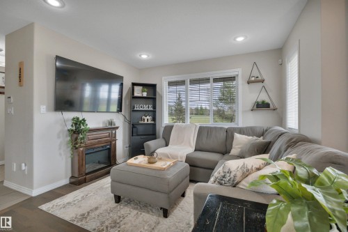 36 Spruce Boulevard, Leduc, AB - Indoor Photo Showing Living Room With Fireplace