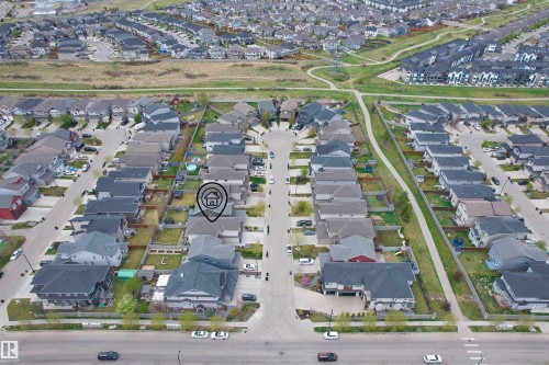 Aerial perspective of a residential neighborhood featuring a tree-lined street and a pedestrian pathway system - 3807 Claxton Close, Edmonton, AB -  With View