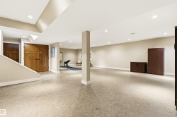 Spacious room featuring light-colored flooring, recessed lighting, and a neutral wall palette - 