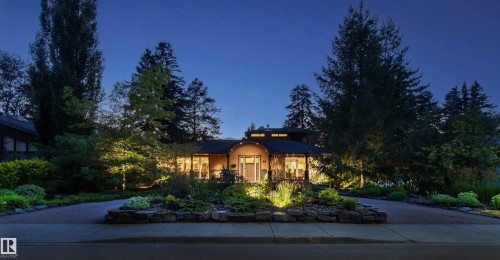 Mid-century modern residence featuring a curved facade, prominent windows, and a two-story design - 9010 120 Street, Edmonton, AB - Outdoor