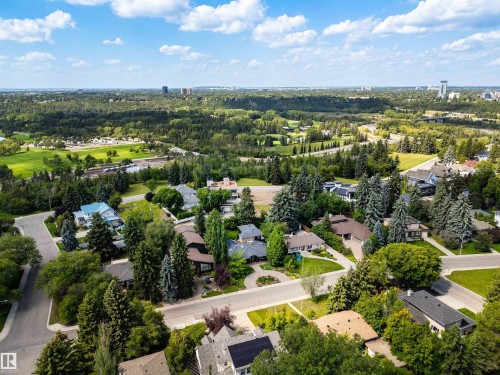 Aerial perspective showcasing a residential area with mature trees and established homes - 9010 120 Street, Edmonton, AB - Outdoor With View