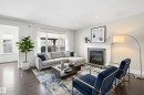 with gas fireplace - 469 Ainslie Crescent Sw, Edmonton, AB  - Indoor Photo Showing Living Room With Fireplace 