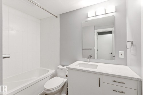 Bathroom featuring a white bathtub and shower with white tile surround - 111 Grosvenor Boulevard, St. Albert, AB - Indoor Photo Showing Bathroom