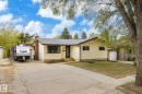 Ranch-style exterior with light yellow siding and dark trim - 111 Grosvenor Boulevard, St. Albert, AB  - Outdoor 