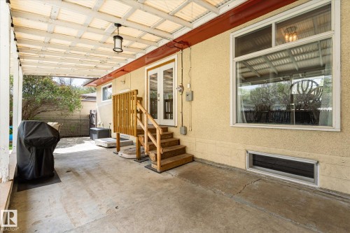 Covered concrete patio with a translucent paneled roof - 111 Grosvenor Boulevard, St. Albert, AB - Outdoor With Exterior