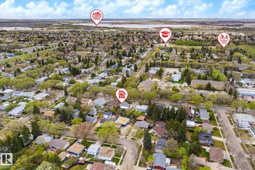 Expansive aerial perspective showcasing a residential neighborhood with mature trees - 111 Grosvenor Boulevard, St. Albert, AB - Outdoor With View