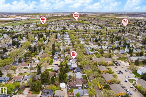 Expansive aerial view showcasing a residential neighborhood with numerous single-family homes and mature tree-lined streets - 111 Grosvenor Boulevard, St. Albert, AB - Outdoor With View