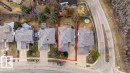 Aerial view showcasing a residential property with a multi-level roofline, a paved driveway, and established trees - 956 Ogilvie Boulevard, Edmonton, AB  -  