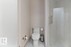 Enclosed shower with clear glass door and brushed nickel hardware - 