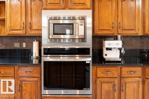 Built-in stainless steel microwave and oven combination - 956 Ogilvie Boulevard, Edmonton, AB - Indoor Photo Showing Kitchen