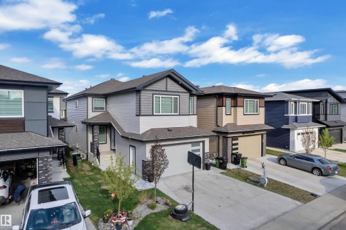 Contemporary two-story residence featuring a multi-textured exterior of siding and shingle accents - 1827 22 Street Nw, Edmonton, AB - Outdoor With Facade