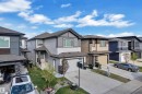 Contemporary two-story residence featuring a multi-textured exterior of siding and shingle accents - 1827 22 Street Nw, Edmonton, AB  - Outdoor With Facade 