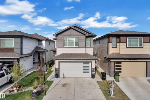 Contemporary two-story residence with multi-toned siding and a dark shingle roof - 1827 22 Street Nw, Edmonton, AB - Outdoor With Facade