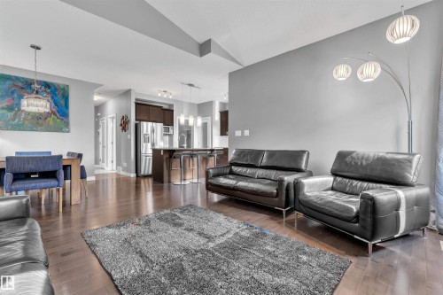 Open concept living area featuring hardwood floors, high ceilings, and recessed lighting - 8108 217 Street, Edmonton, AB - Indoor Photo Showing Living Room