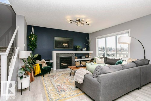 2423 16 Avenue, Edmonton, AB - Indoor Photo Showing Living Room With Fireplace