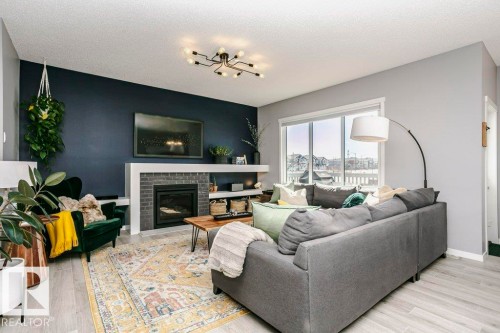 2423 16 Avenue, Edmonton, AB - Indoor Photo Showing Living Room With Fireplace