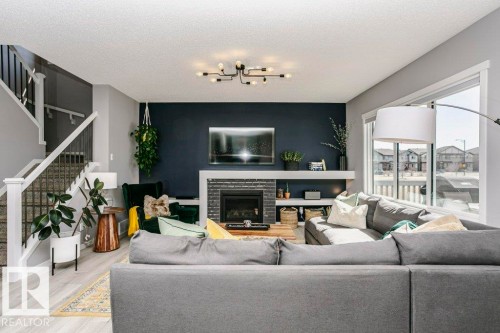 2423 16 Avenue, Edmonton, AB - Indoor Photo Showing Living Room With Fireplace