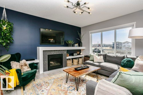2423 16 Avenue, Edmonton, AB - Indoor Photo Showing Living Room With Fireplace