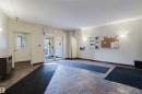 Entrance foyer featuring large format stone tile flooring - 308 4316 139 Avenue, Edmonton, AB 