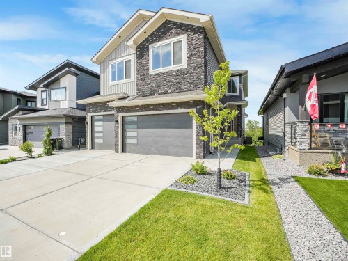 Modern two-story residence featuring a stone and siding exterior - 15 Elwyck Gate, Spruce Grove, AB - Outdoor With Facade