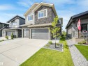 Modern two-story residence featuring a stone and siding exterior - 15 Elwyck Gate, Spruce Grove, AB  - Outdoor With Facade 