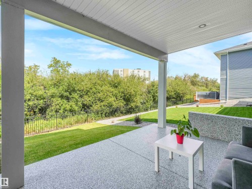 Covered patio featuring a textured concrete surface and recessed lighting - 15 Elwyck Gate, Spruce Grove, AB - Outdoor With Deck Patio Veranda With Exterior