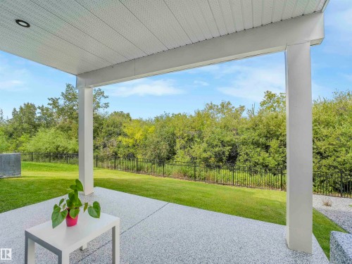 Covered patio featuring a granular texture concrete surface - 15 Elwyck Gate, Spruce Grove, AB - Outdoor With Deck Patio Veranda
