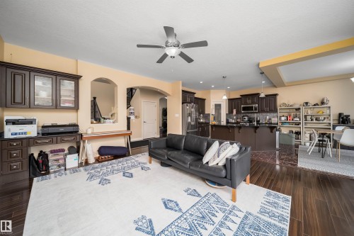 Expansive open-concept living area featuring wood-finish flooring, a ceiling fan, and recessed lighting - 1508 Cunningham Cape Cape, Edmonton, AB - Indoor