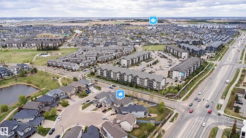 Expansive aerial view showcasing a developed residential area with a prominent multi-lane thoroughfare - 1508 Cunningham Cape Cape, Edmonton, AB - Outdoor With View
