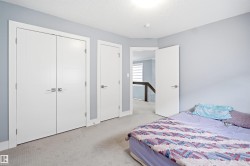 Wall-to-wall carpeted room with light blue walls and white trim - 