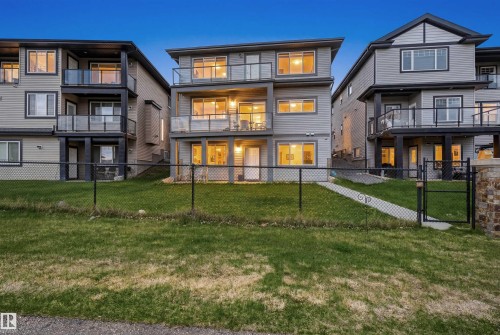 Modern multi-level residence featuring light gray siding and dark trim accents - 3909 49 Ave, Beaumont, AB - Outdoor With Facade