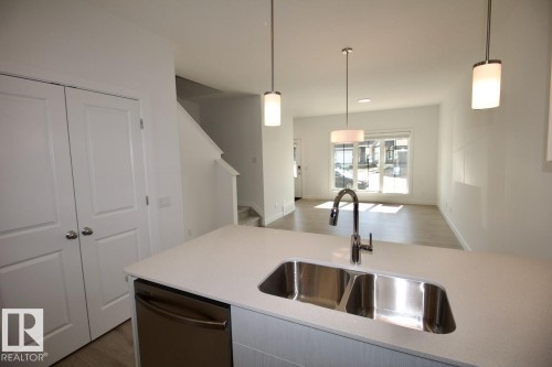 Upper 3862 Chrustawka Place Sw, Edmonton, AB - Indoor Photo Showing Kitchen With Double Sink