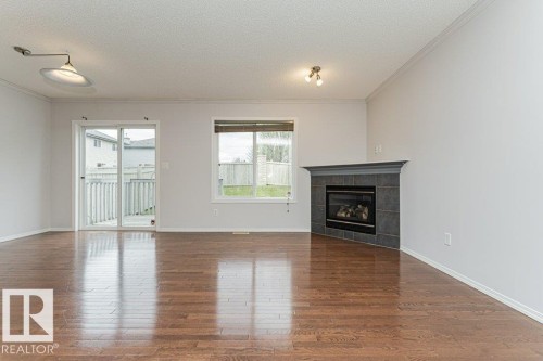 2314 Lemieux Place, Edmonton, AB - Indoor Photo Showing Living Room With Fireplace
