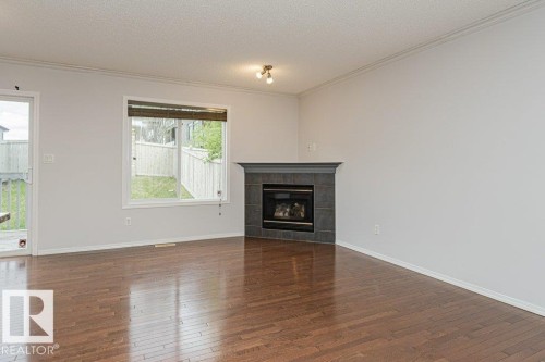 2314 Lemieux Place, Edmonton, AB - Indoor Photo Showing Living Room With Fireplace