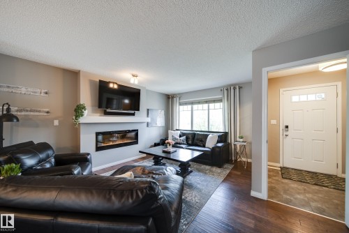 3365 Orchards Link Link, Edmonton, AB - Indoor Photo Showing Living Room With Fireplace