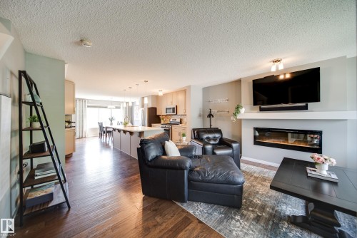 3365 Orchards Link Link, Edmonton, AB - Indoor Photo Showing Living Room With Fireplace
