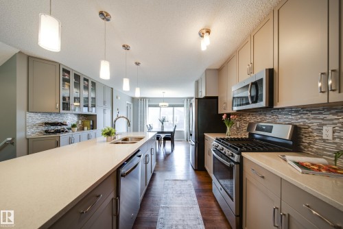3365 Orchards Link Link, Edmonton, AB - Indoor Photo Showing Kitchen With Stainless Steel Kitchen With Double Sink With Upgraded Kitchen