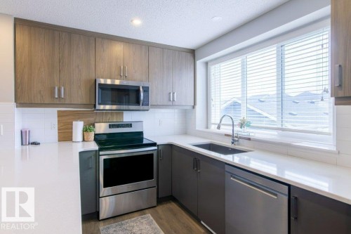 215 Southfork Drive, Leduc, AB - Indoor Photo Showing Kitchen With Stainless Steel Kitchen