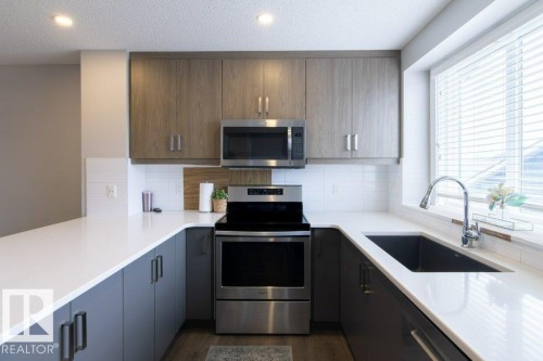 215 Southfork Drive, Leduc, AB - Indoor Photo Showing Kitchen With Upgraded Kitchen