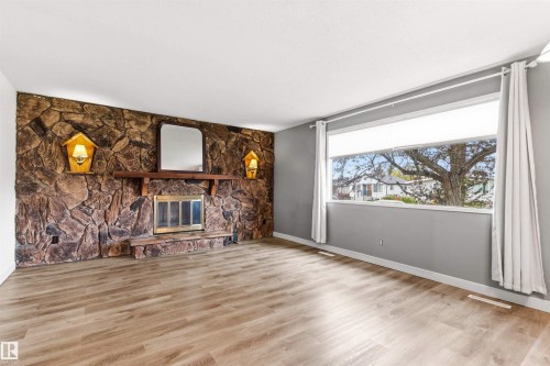 9025 152 Street, Edmonton, AB - Indoor Photo Showing Living Room With Fireplace