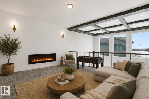 Upper-level bonus room featuring an electric fireplace, two wall sconces, a coffered ceiling, and large windows with exterior visibility - 17107 3 Street Nw, Edmonton, AB - Indoor Photo Showing Living Room With Fireplace