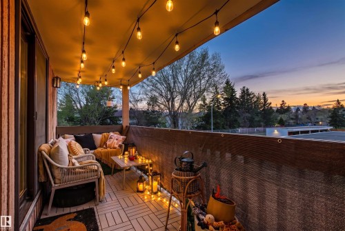 Private balcony featuring plank-style flooring and a slatted privacy screen - 217 14819 51 Avenue, Edmonton, AB - Outdoor