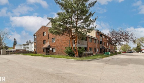 Multi-story brick building with multiple balconies and a covered entrance - 217 14819 51 Avenue, Edmonton, AB - Outdoor