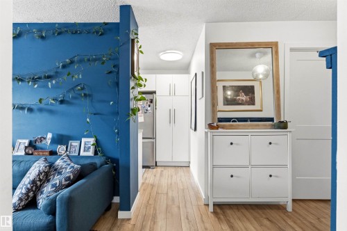 Wood-finish flooring throughout the space - 217 14819 51 Avenue, Edmonton, AB - Indoor