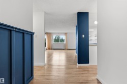 Open concept main living area featuring light wood-finish flooring - 