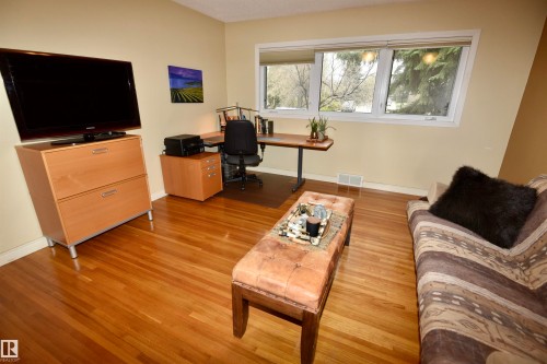 Hardwood flooring throughout this versatile interior space - 13910 101A Avenue, Edmonton, AB - Indoor
