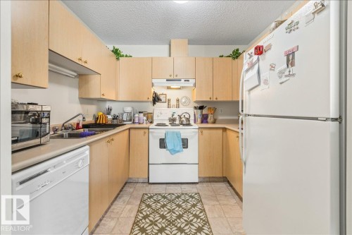 #106B 114 Westpark Dr, Fort Saskatchewan, AB - Indoor Photo Showing Kitchen With Double Sink