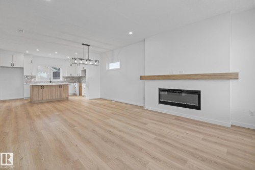 54 Eden Link, Fort Saskatchewan, AB - Indoor Photo Showing Living Room With Fireplace