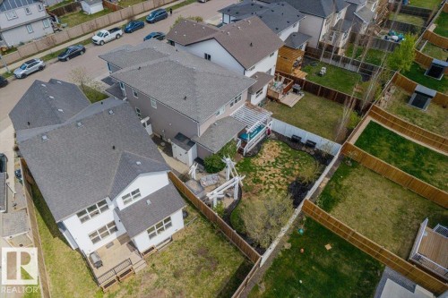 Expansive backyard featuring a pergola-covered patio with seating, established landscaping, and a privacy fence - 22933 94A Avenue, Edmonton, AB - Outdoor With View