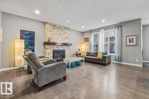 22933 94A Avenue, Edmonton, AB - Indoor Photo Showing Living Room With Fireplace